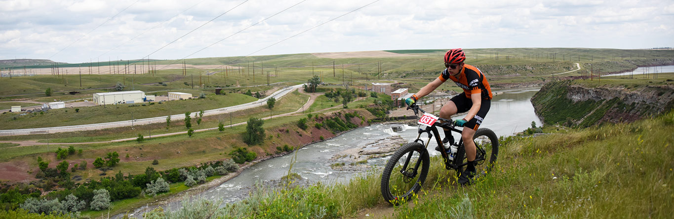 A mountain biker rides a trail along the Missouri River in Great Falls.
