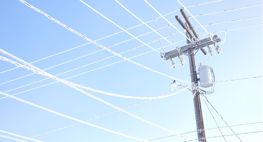 frost on powerlines and a cold, clear day