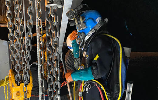 Travis Wilson, a diver from Associated Underwater Services, preps to go into the river to look at the component that failed on Hebgen Dam.