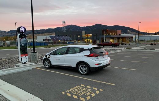 An electric vehicle charges outside our Bozeman office.