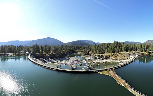 Thompson Falls Dam on a blue sky day